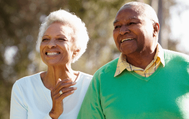 Elderly Couple Outside Smiling