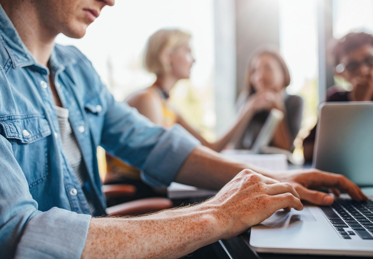 Man typing on laptop