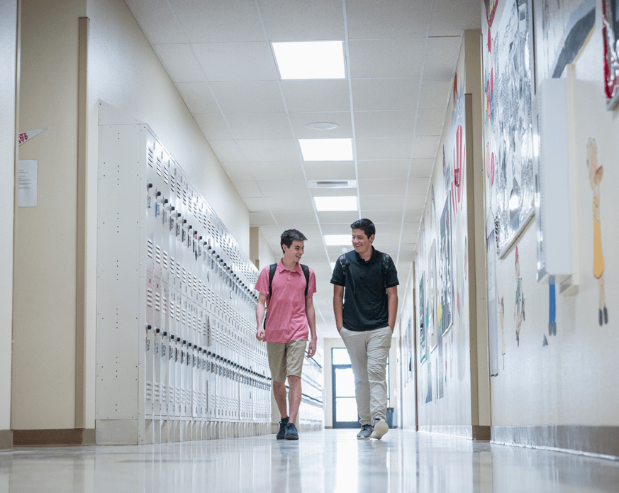 teens walking down a school halway