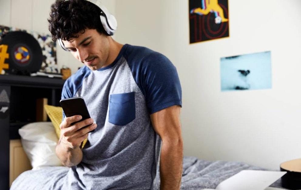 Young man making an online purchase with his smartphone